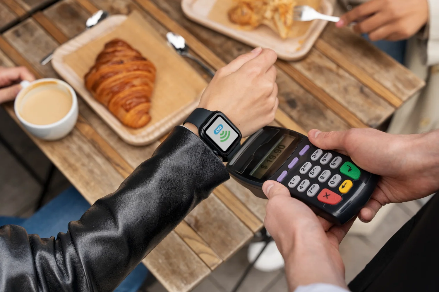 a mobile POS system being used on a smart watch.
